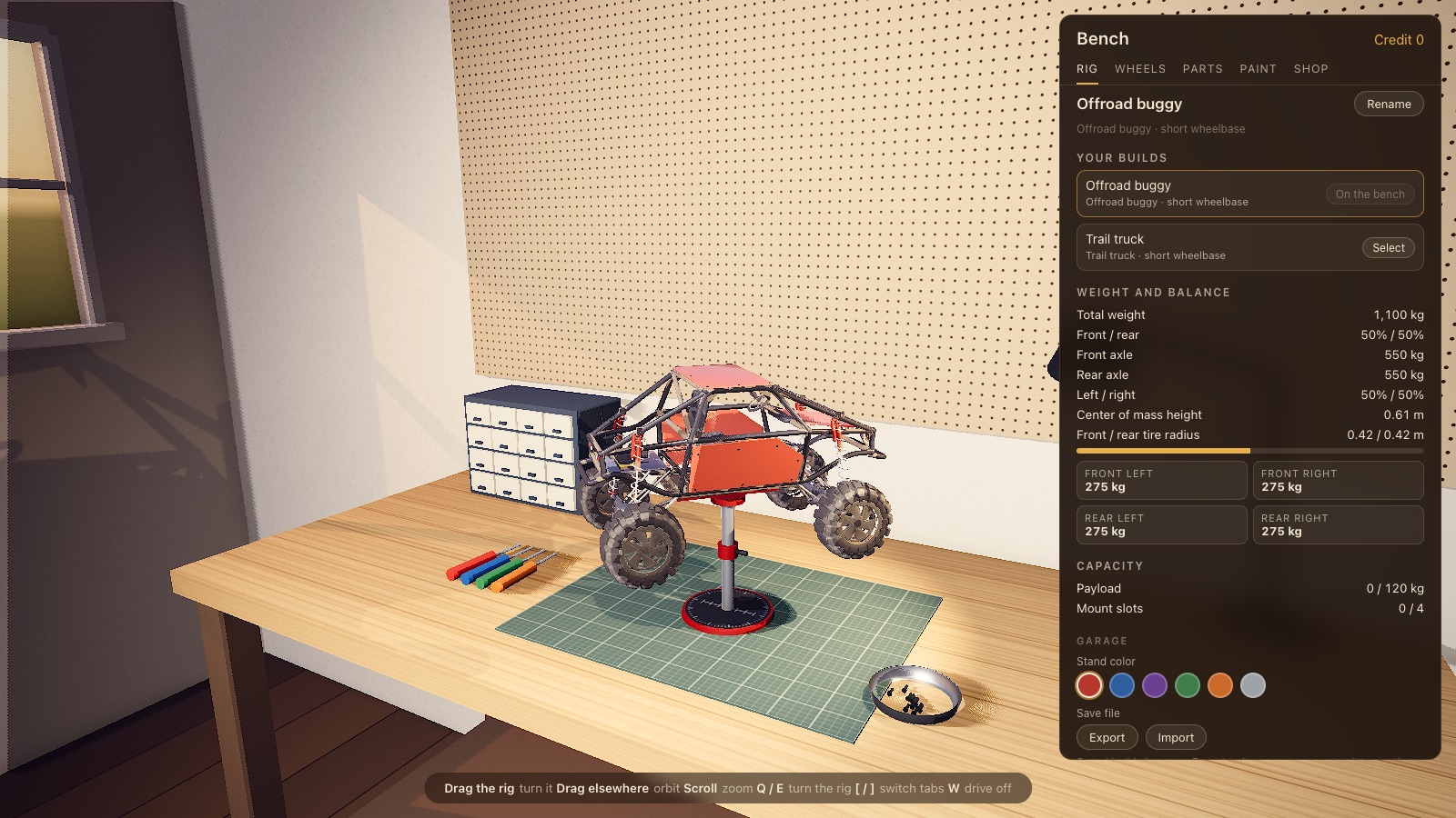 The garage bench with a buggy on a stand and the weight and balance panel beside it.